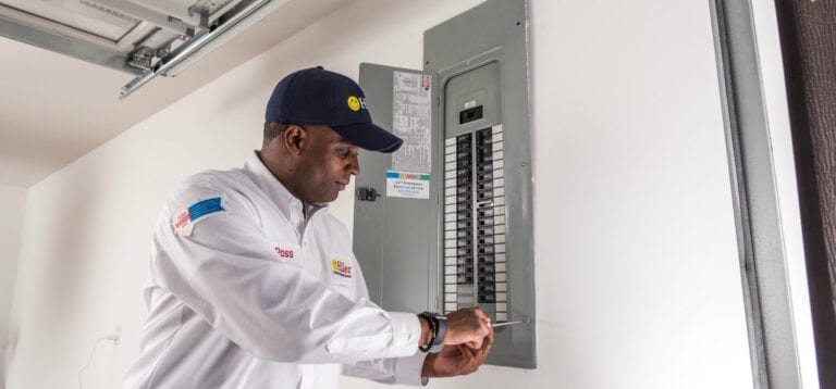 Electrician Installing Breaker Panel